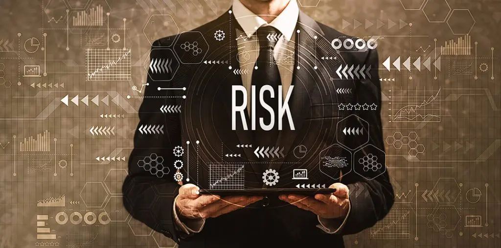 Glenn Gow Risk Management Graphic Man Holding Ipad with Charts and Data 1024x507 1